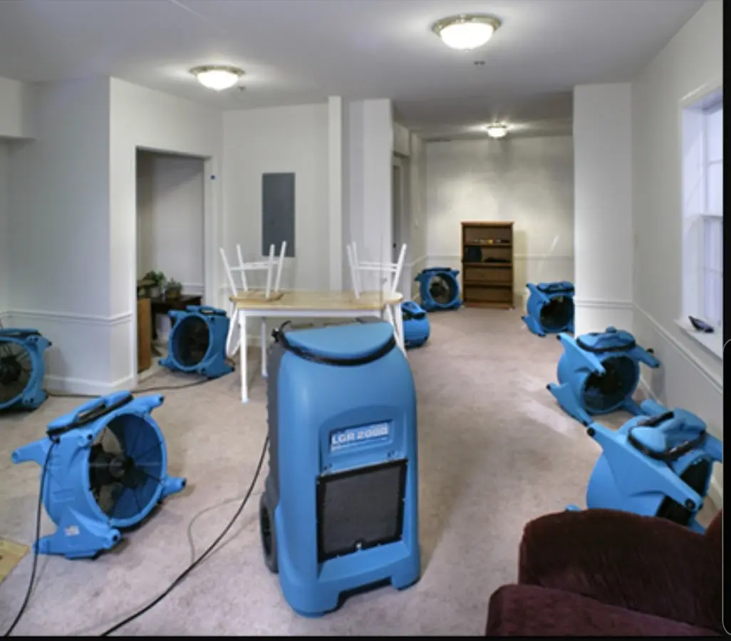 Air movers and dehumidifier setup for Water Damage Restoration in Houghton